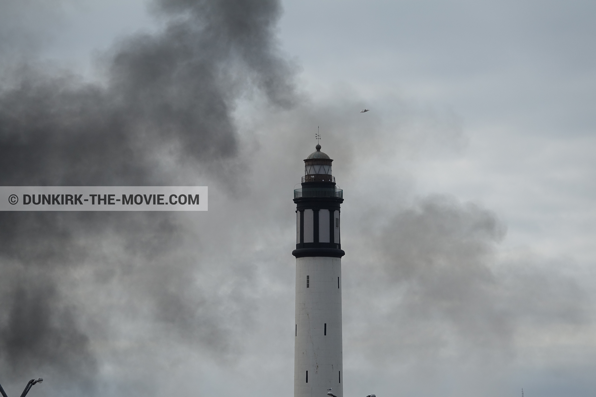 Picture with black smoke, Dunkirk lighthouse,  from behind the scene of the Dunkirk movie by Nolan