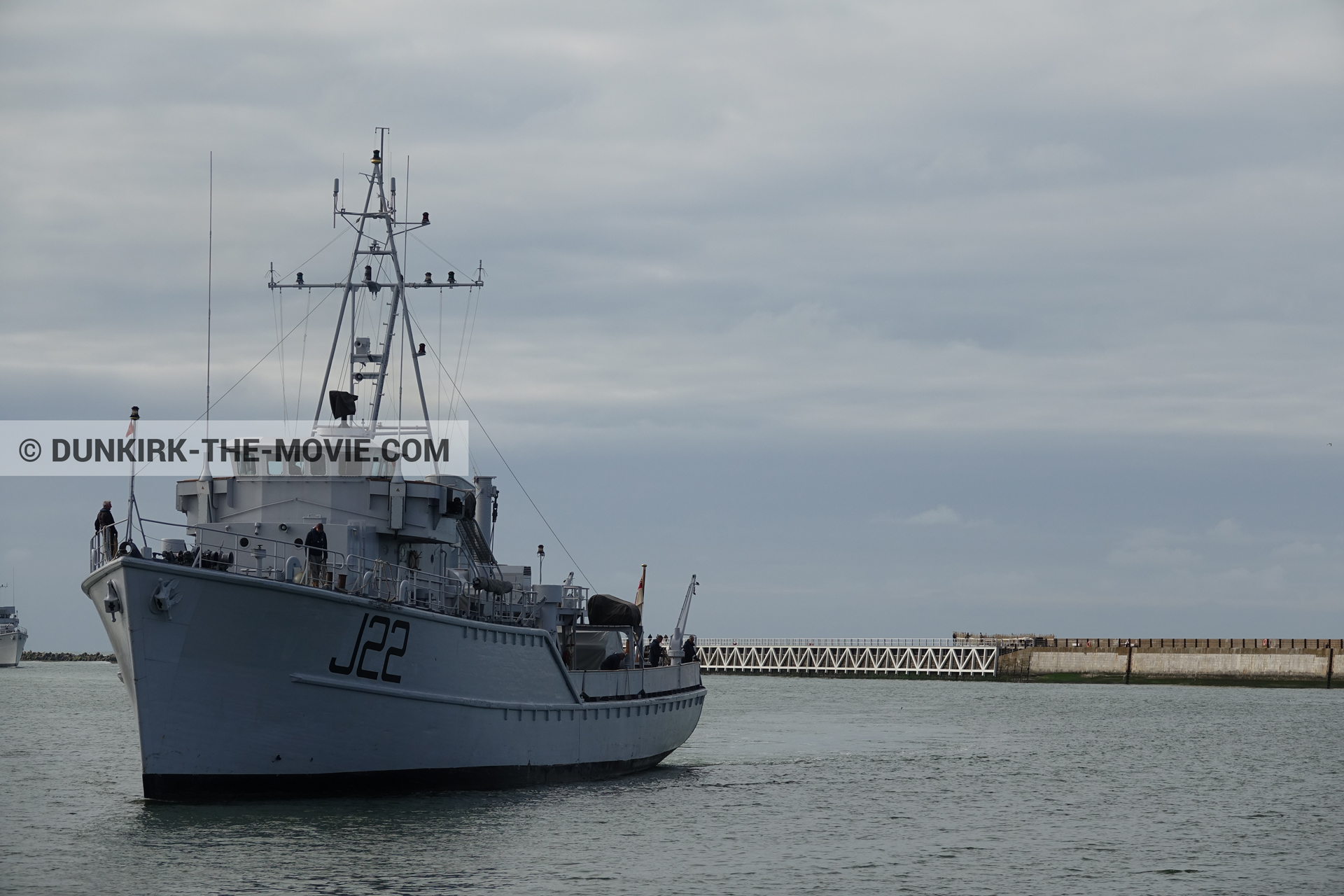 Picture with boat, cloudy sky, J22 -Hr.Ms. Naaldwijk, EST pier, calm sea,  from behind the scene of the Dunkirk movie by Nolan