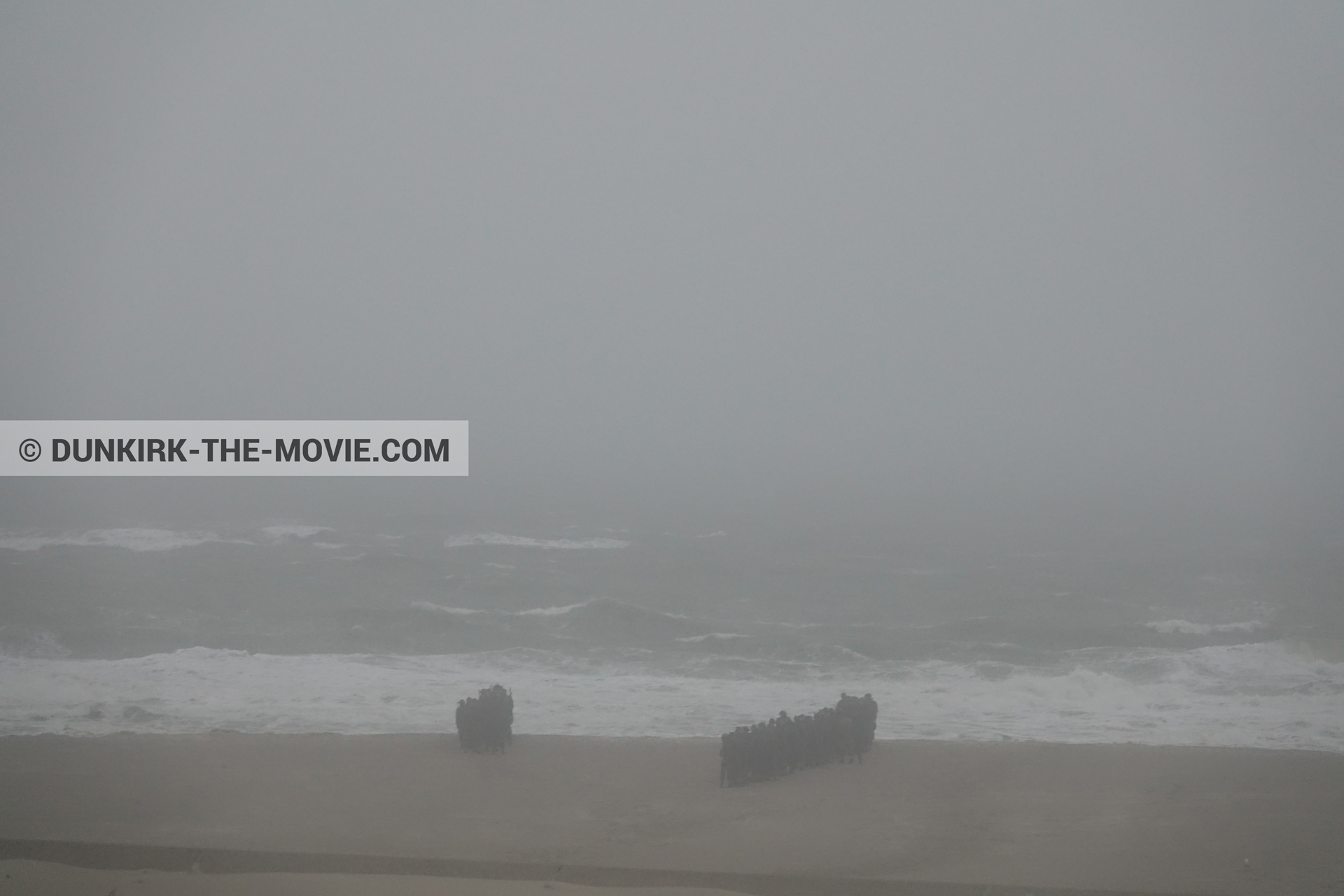 Picture with supernumeraries, rough sea, beach,  from behind the scene of the Dunkirk movie by Nolan