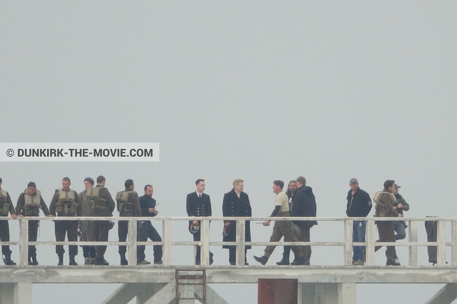 Picture with grey sky, supernumeraries, Hoyte van Hoytema, EST pier, Kenneth Branagh, Christopher Nolan, technical team,  from behind the scene of the Dunkirk movie by Nolan