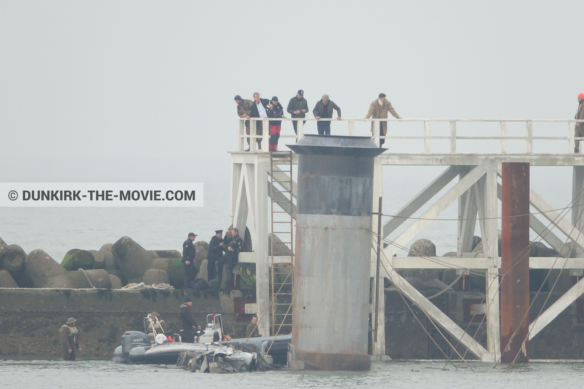 Picture with actor, grey sky, decor, supernumeraries, EST pier, Christopher Nolan, technical team, Nilo Otero,  from behind the scene of the Dunkirk movie by Nolan