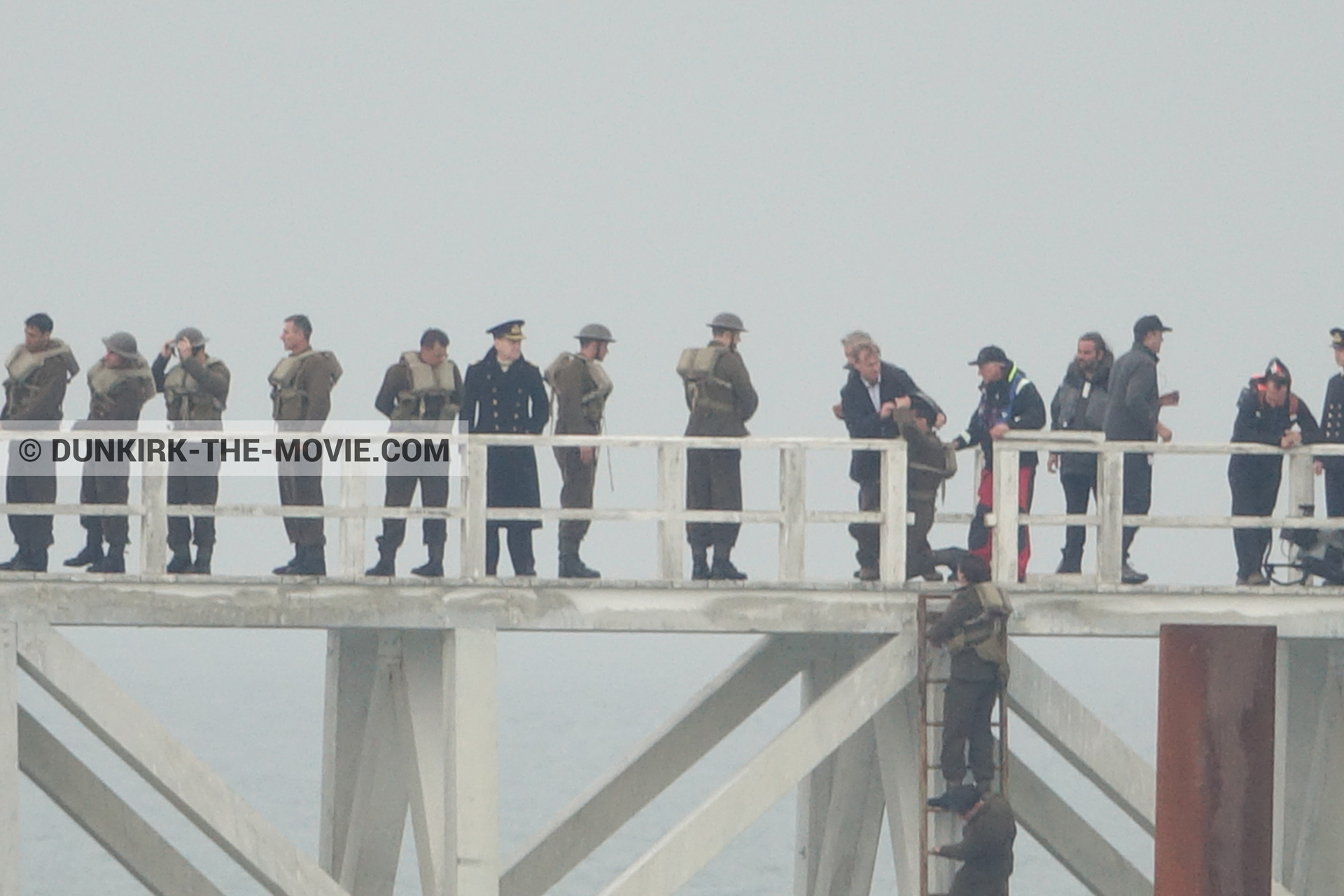 Picture with actor, grey sky, supernumeraries, Hoyte van Hoytema, EST pier, Kenneth Branagh, Christopher Nolan, technical team,  from behind the scene of the Dunkirk movie by Nolan