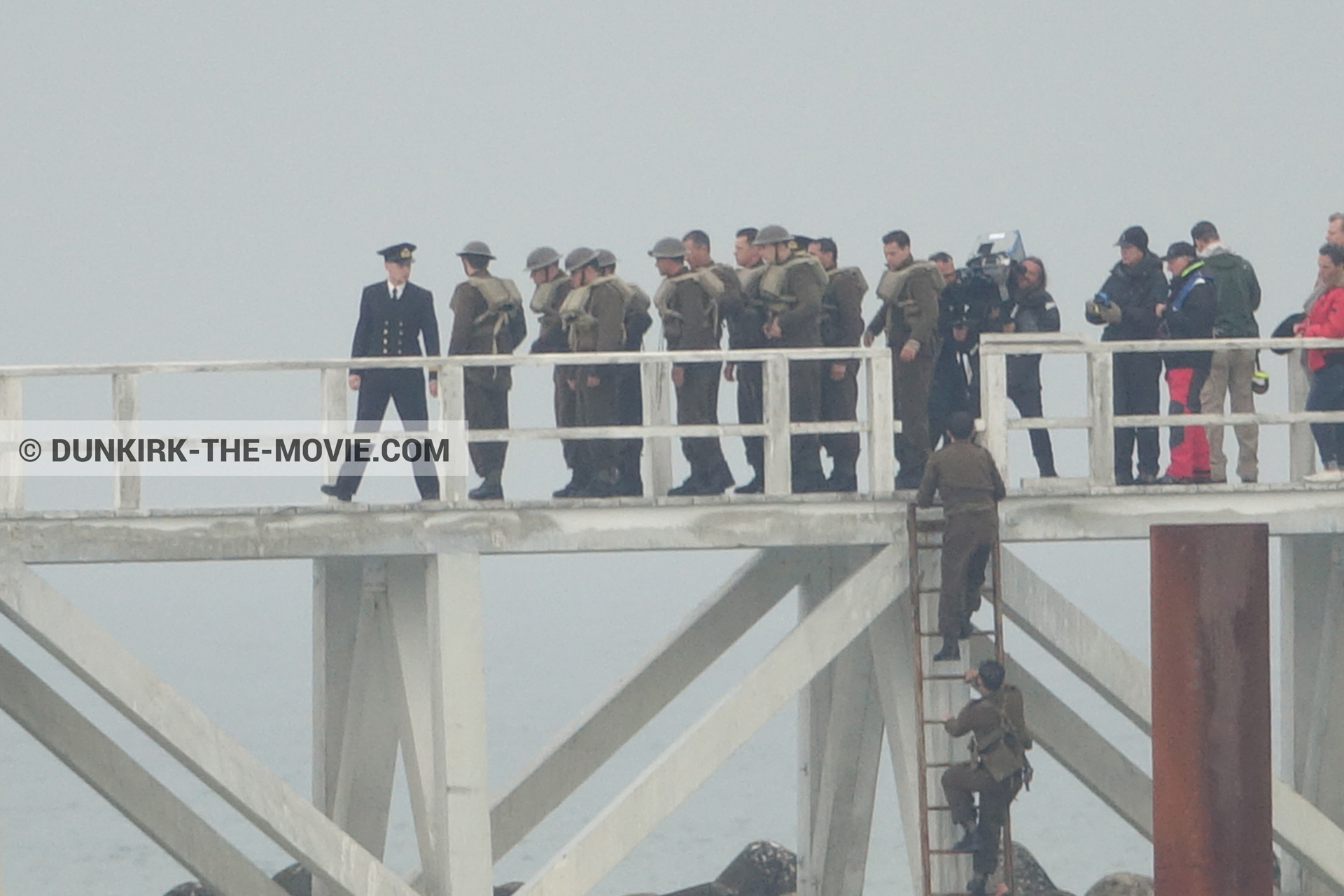 Picture with actor, IMAX camera, grey sky, supernumeraries, Hoyte van Hoytema, EST pier,  from behind the scene of the Dunkirk movie by Nolan