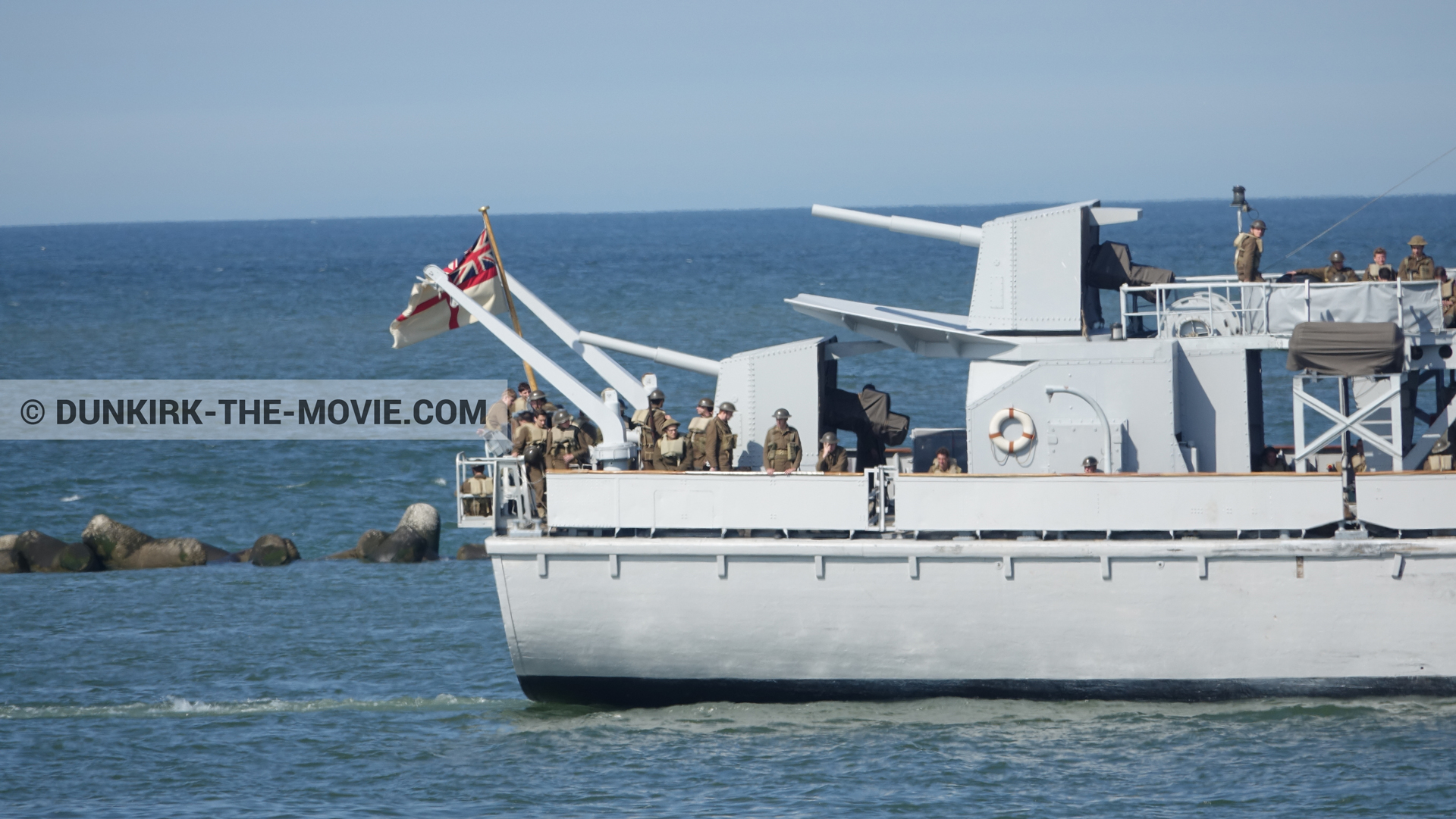 Picture with blue sky, F34 - Hr.Ms. Sittard, supernumeraries, calm sea,  from behind the scene of the Dunkirk movie by Nolan