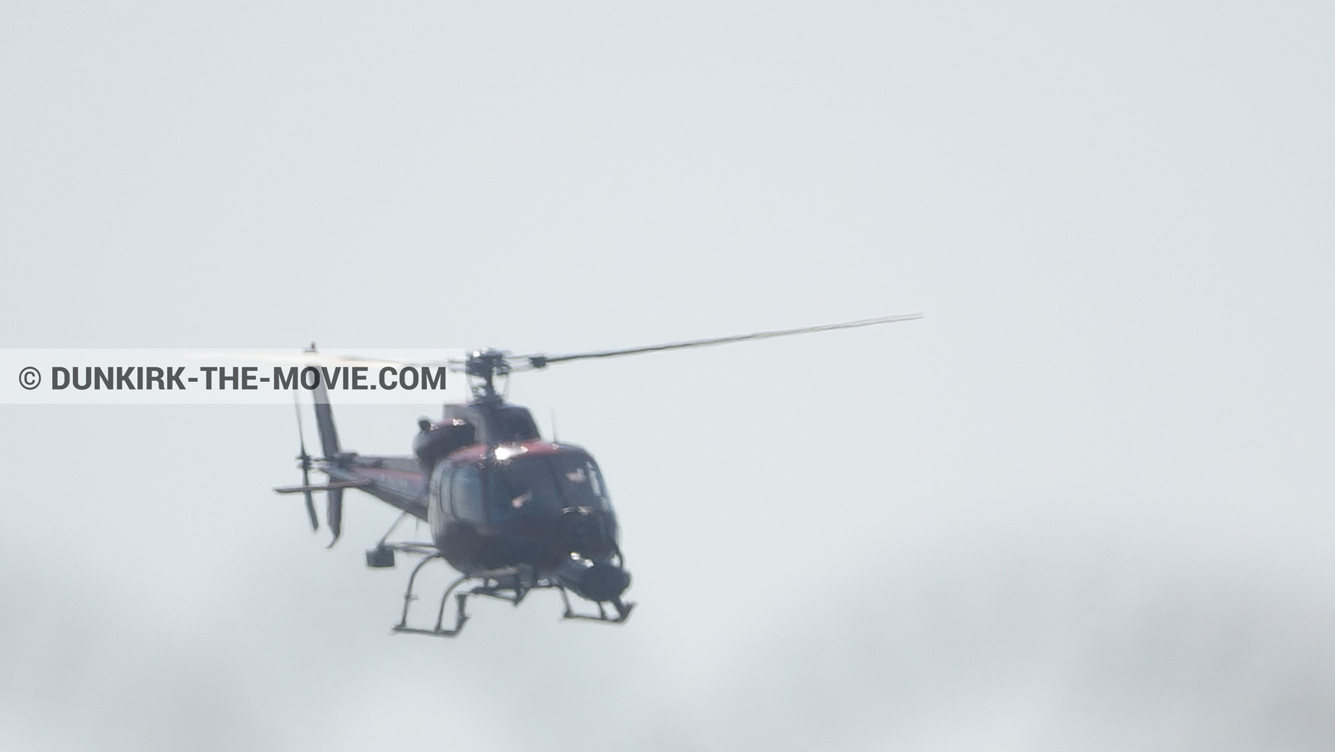 Picture with grey sky, helicopter camera,  from behind the scene of the Dunkirk movie by Nolan