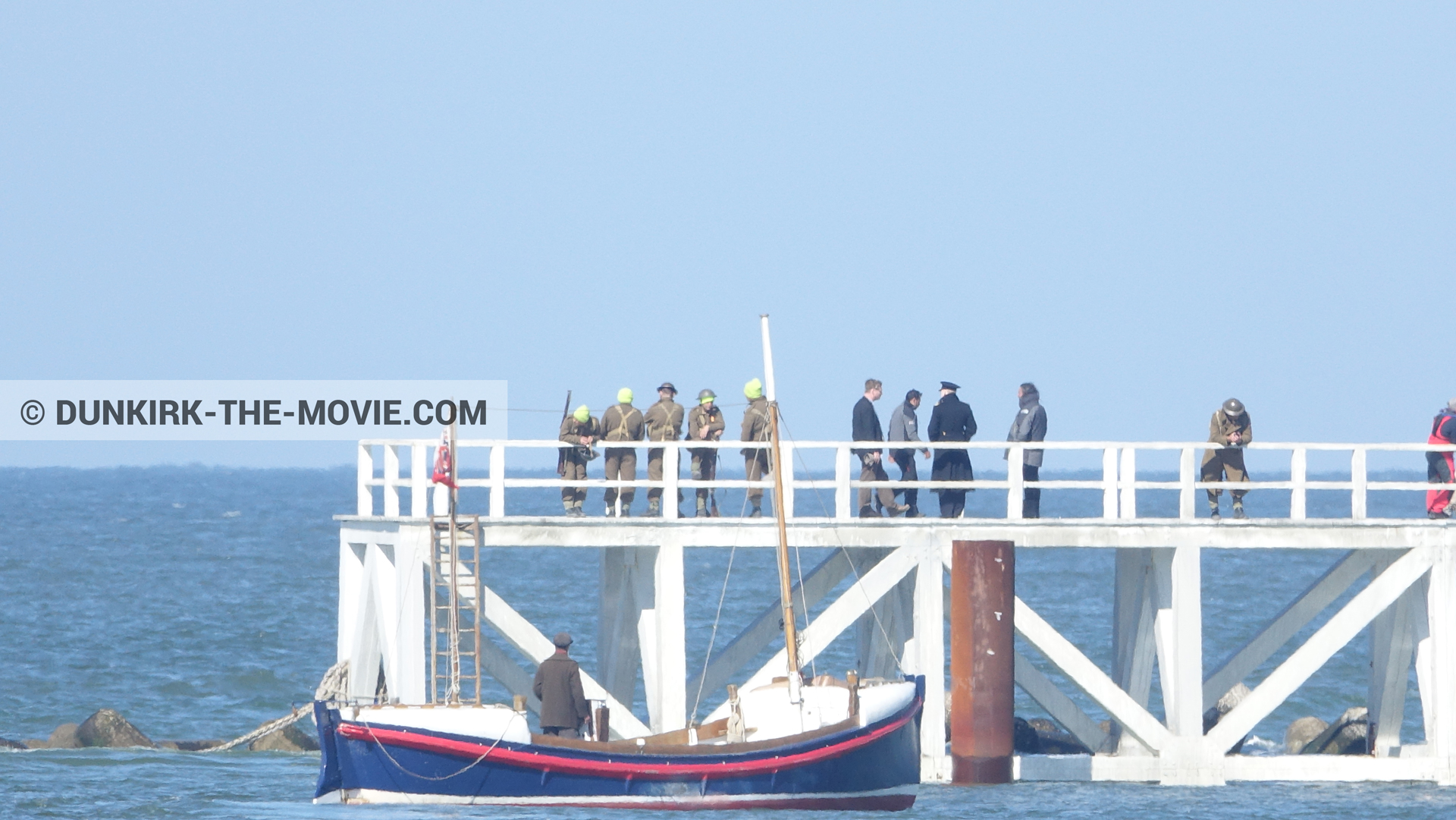 Picture with boat, blue sky, supernumeraries, Hoyte van Hoytema, EST pier, Kenneth Branagh, Christopher Nolan, Henry Finlay lifeboat,  from behind the scene of the Dunkirk movie by Nolan