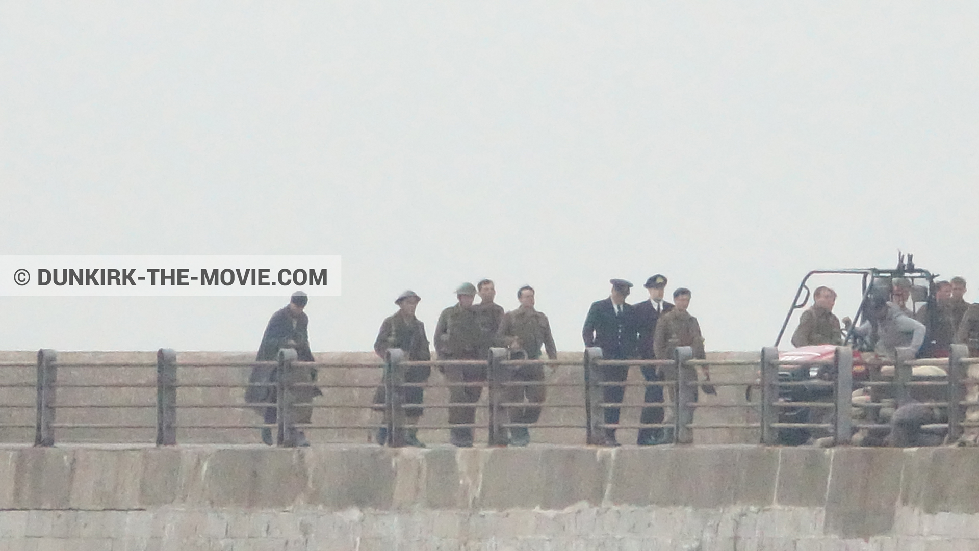 Picture with actor, grey sky, supernumeraries, EST pier, Kenneth Branagh, technical team,  from behind the scene of the Dunkirk movie by Nolan