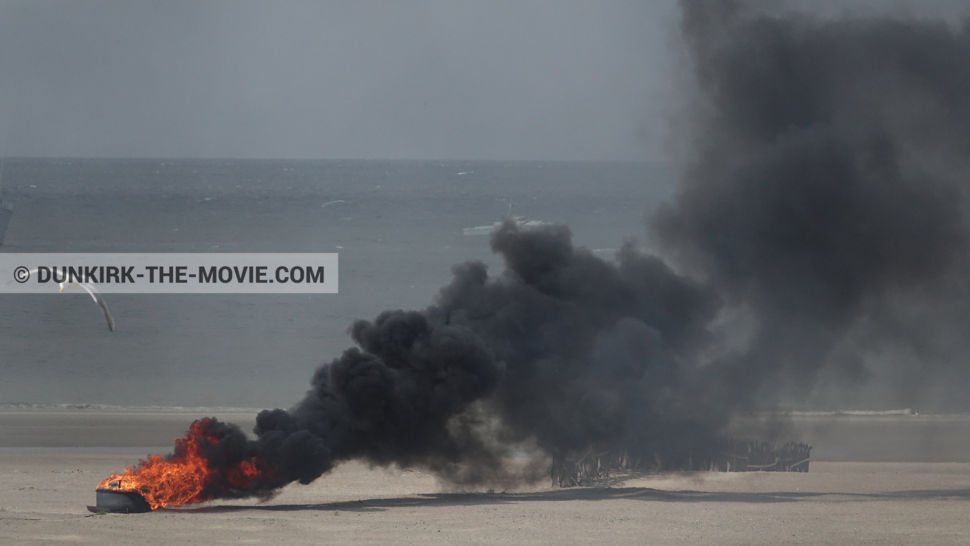 Picture with black smoke, beach,  from behind the scene of the Dunkirk movie by Nolan