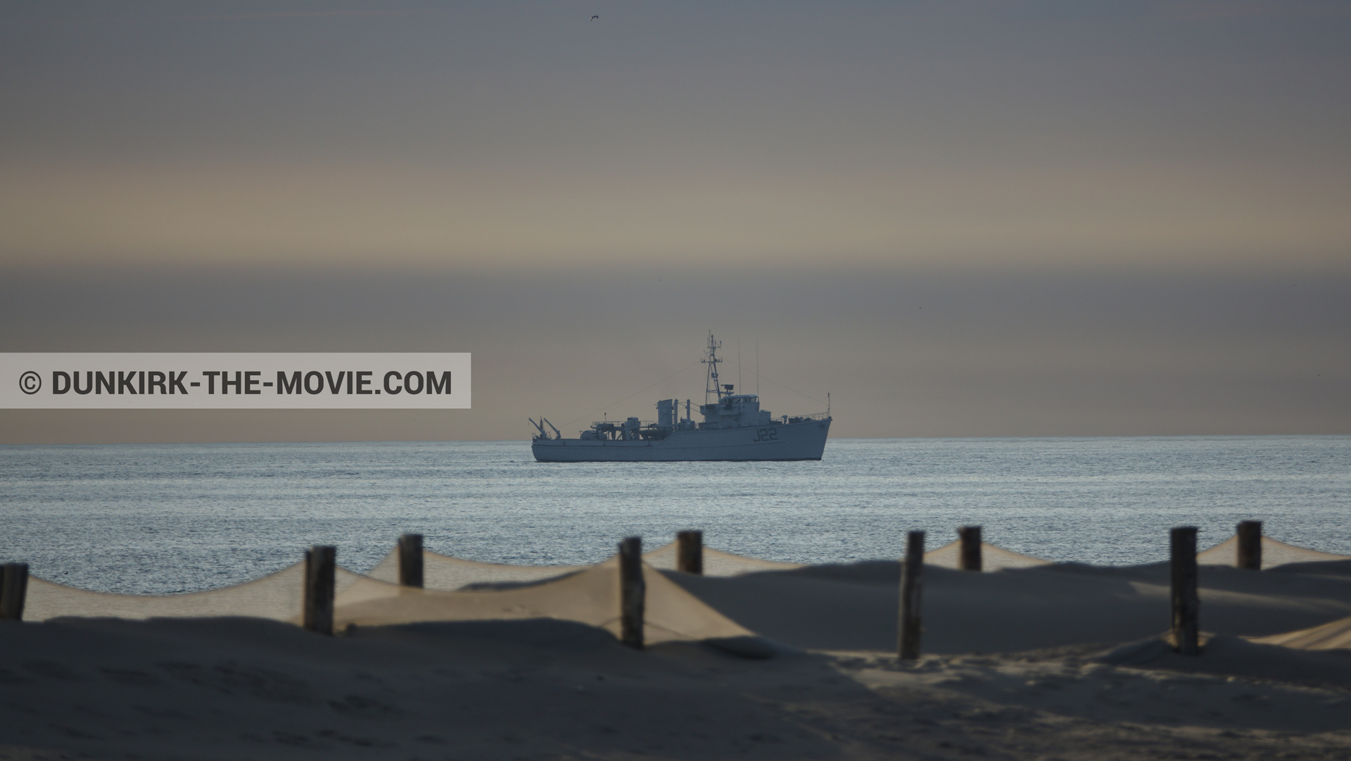 Picture with orange sky, J22 -Hr.Ms. Naaldwijk, calm sea, beach,  from behind the scene of the Dunkirk movie by Nolan