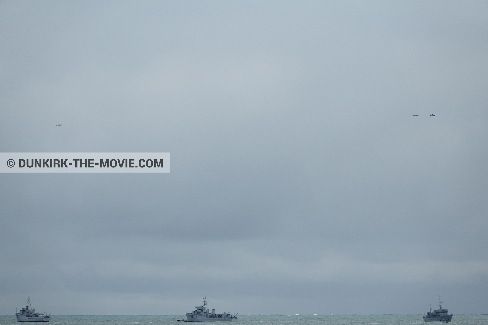 Picture with boat, grey sky,  from behind the scene of the Dunkirk movie by Nolan