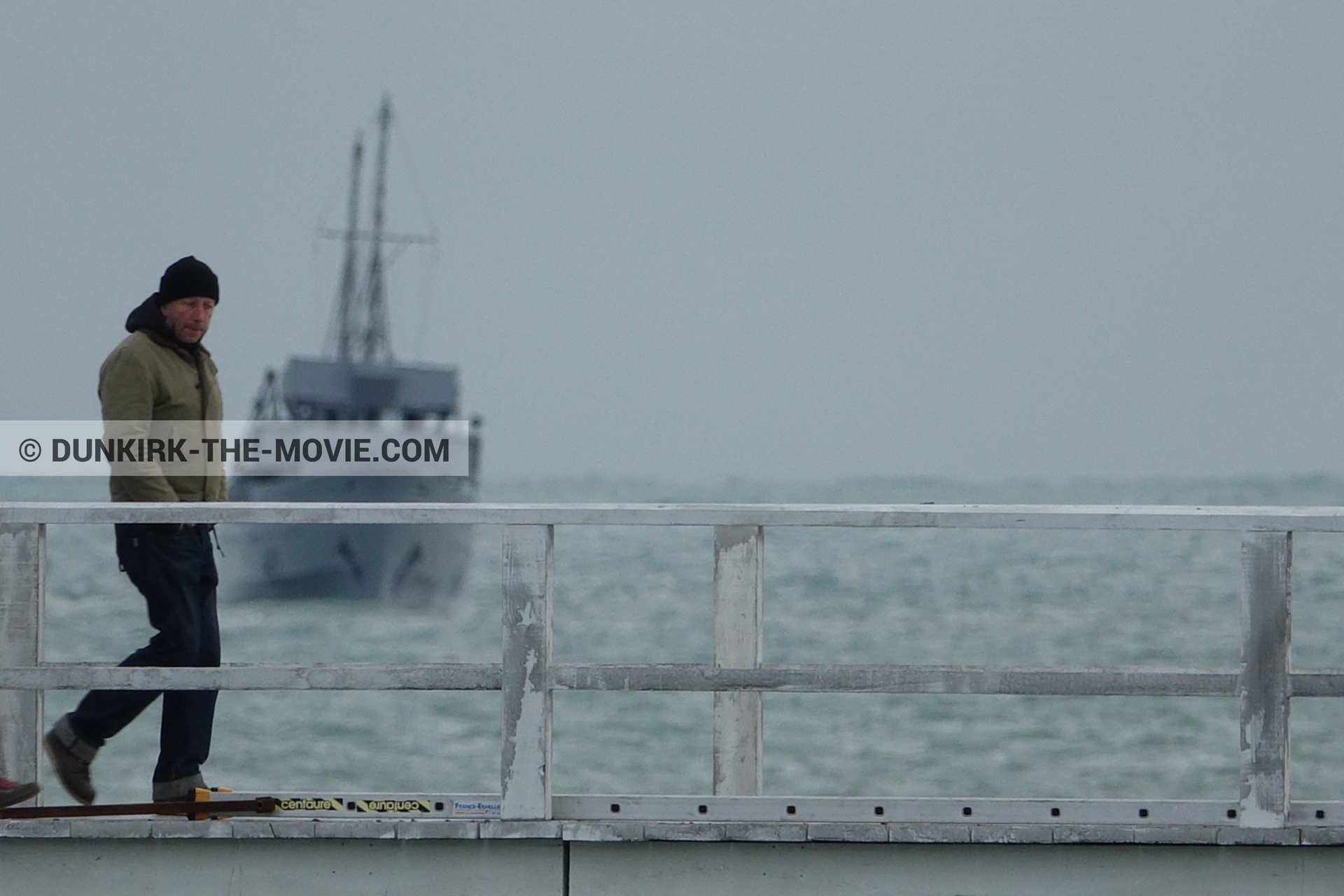 Picture with boat, grey sky, EST pier, technical team,  from behind the scene of the Dunkirk movie by Nolan