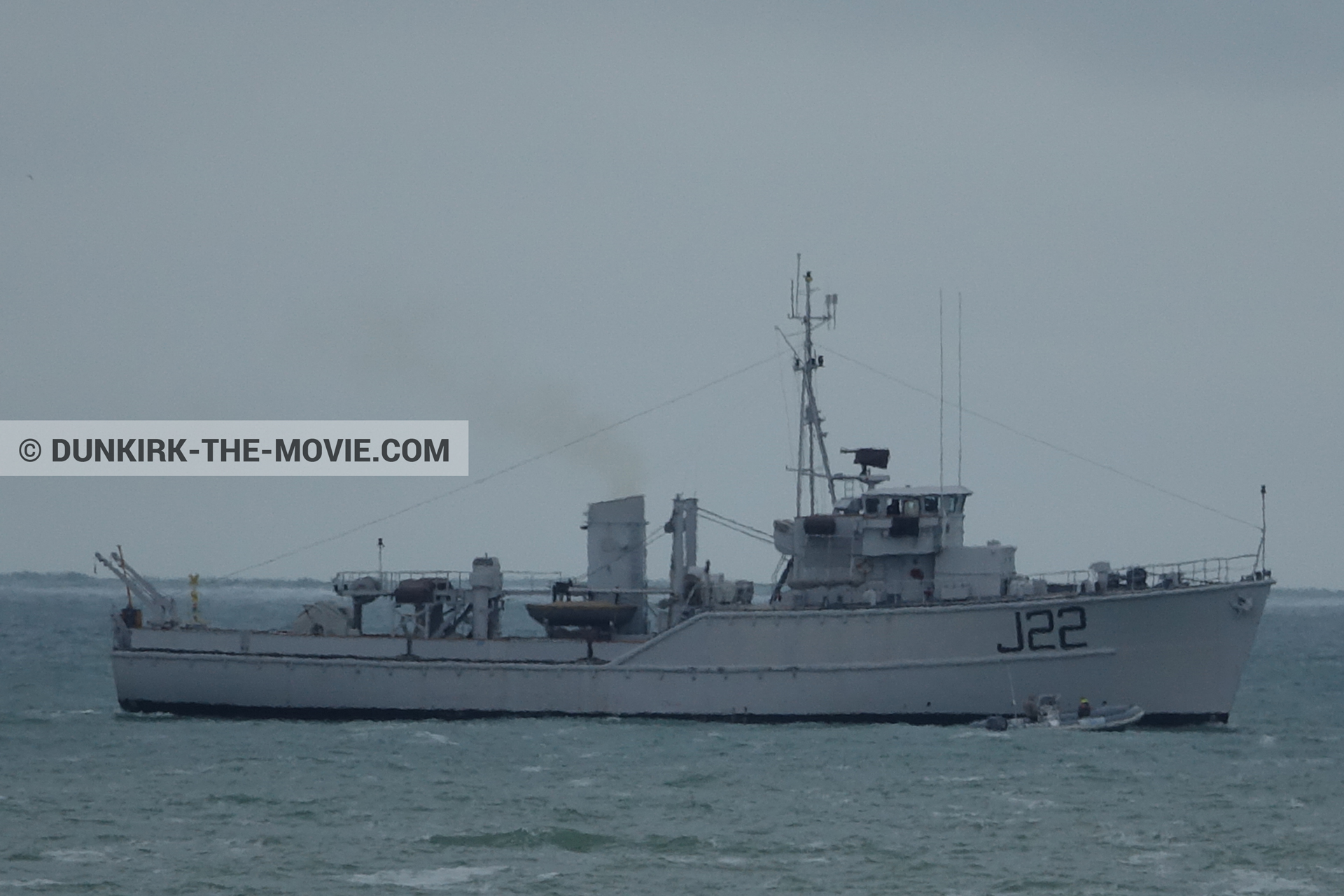 Picture with boat, grey sky, J22 -Hr.Ms. Naaldwijk, calm sea,  from behind the scene of the Dunkirk movie by Nolan