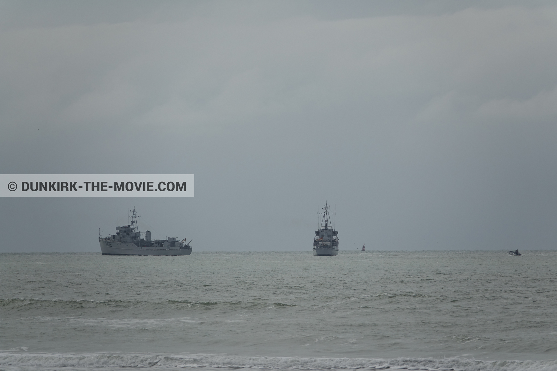 Picture with boat, grey sky, rough sea,  from behind the scene of the Dunkirk movie by Nolan