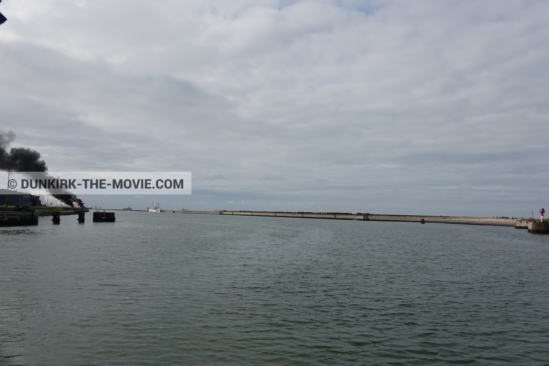 Picture with black smoke, EST pier, calm sea,  from behind the scene of the Dunkirk movie by Nolan