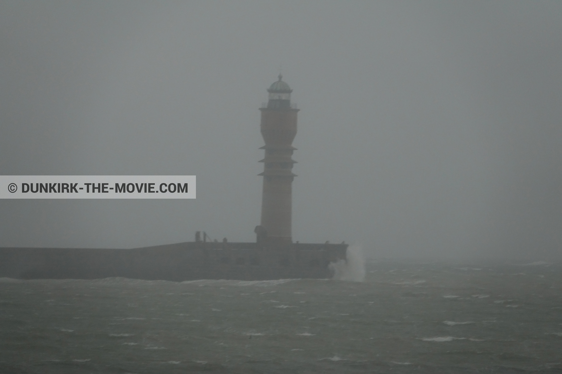 Picture with grey sky, rough sea, St Pol sur Mer lighthouse,  from behind the scene of the Dunkirk movie by Nolan