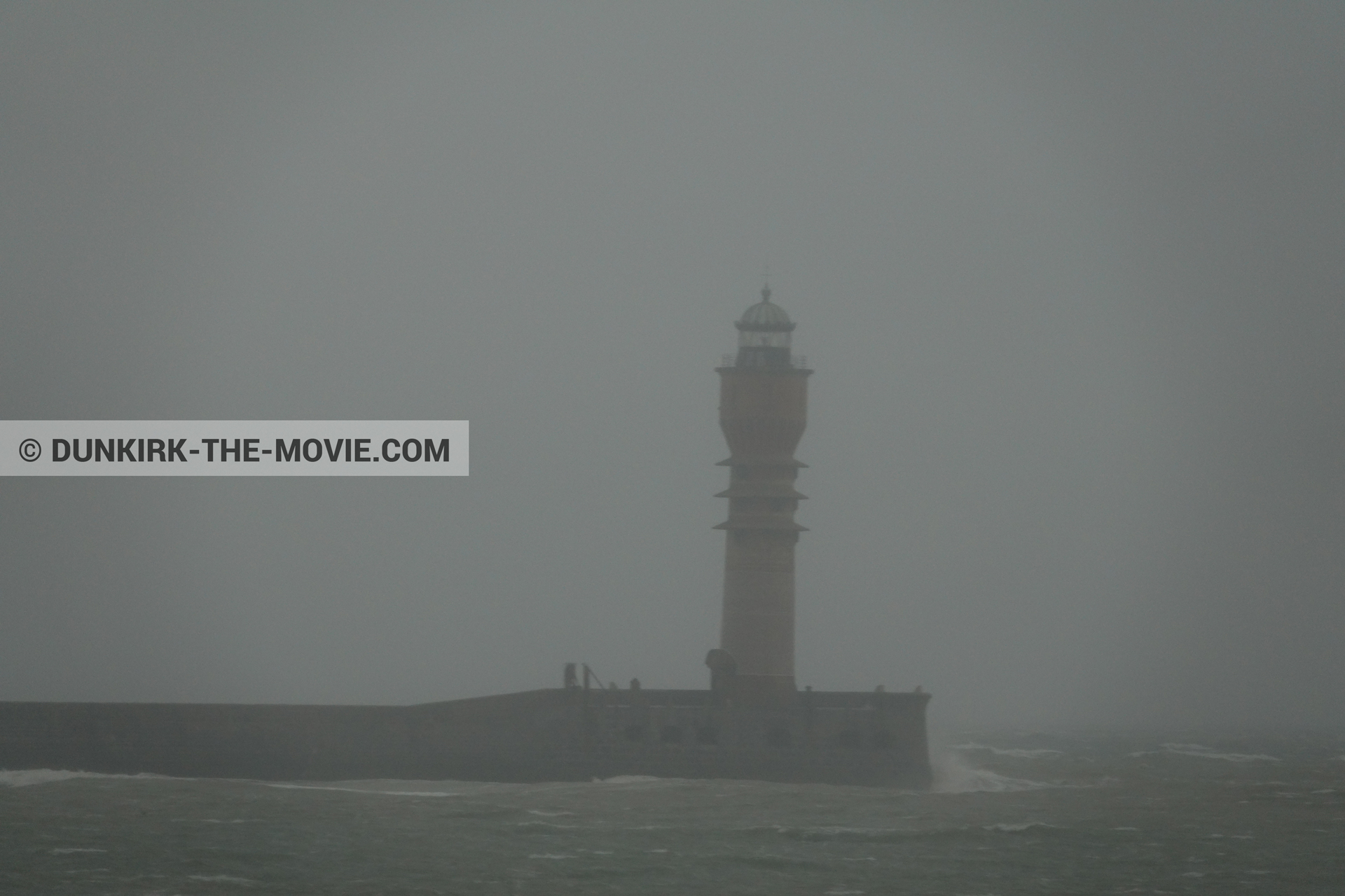 Picture with grey sky, rough sea, St Pol sur Mer lighthouse,  from behind the scene of the Dunkirk movie by Nolan