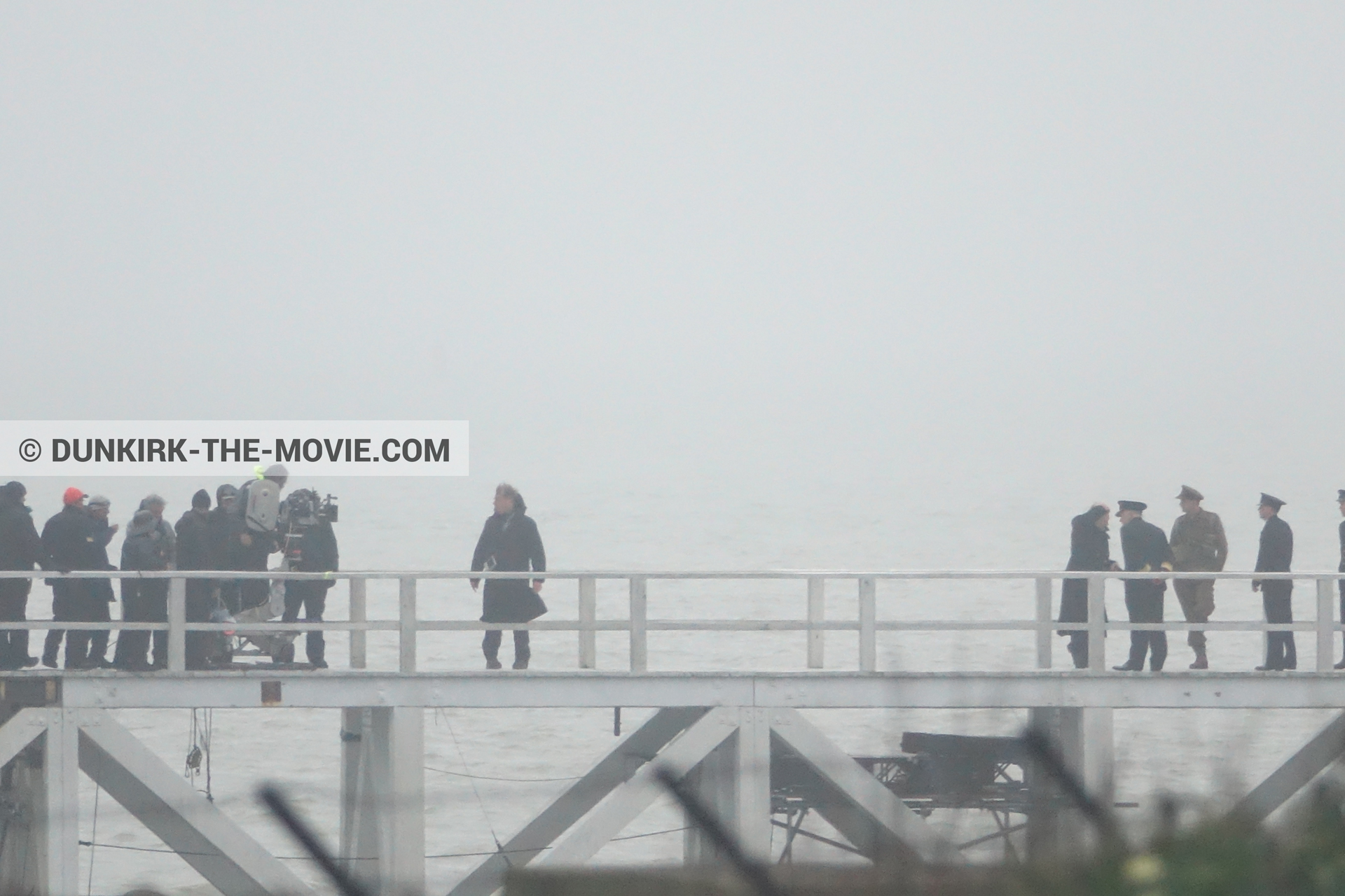Picture with actor, grey sky, EST pier, technical team,  from behind the scene of the Dunkirk movie by Nolan