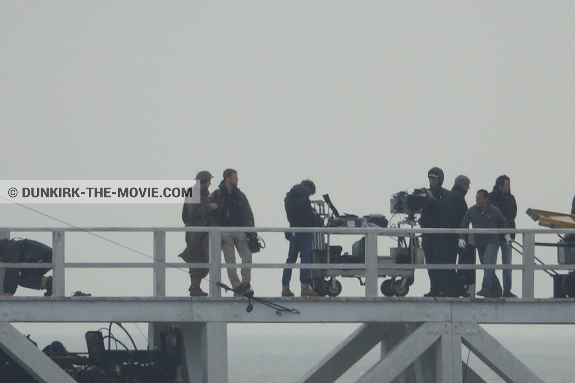 Picture with grey sky, EST pier, technical team,  from behind the scene of the Dunkirk movie by Nolan