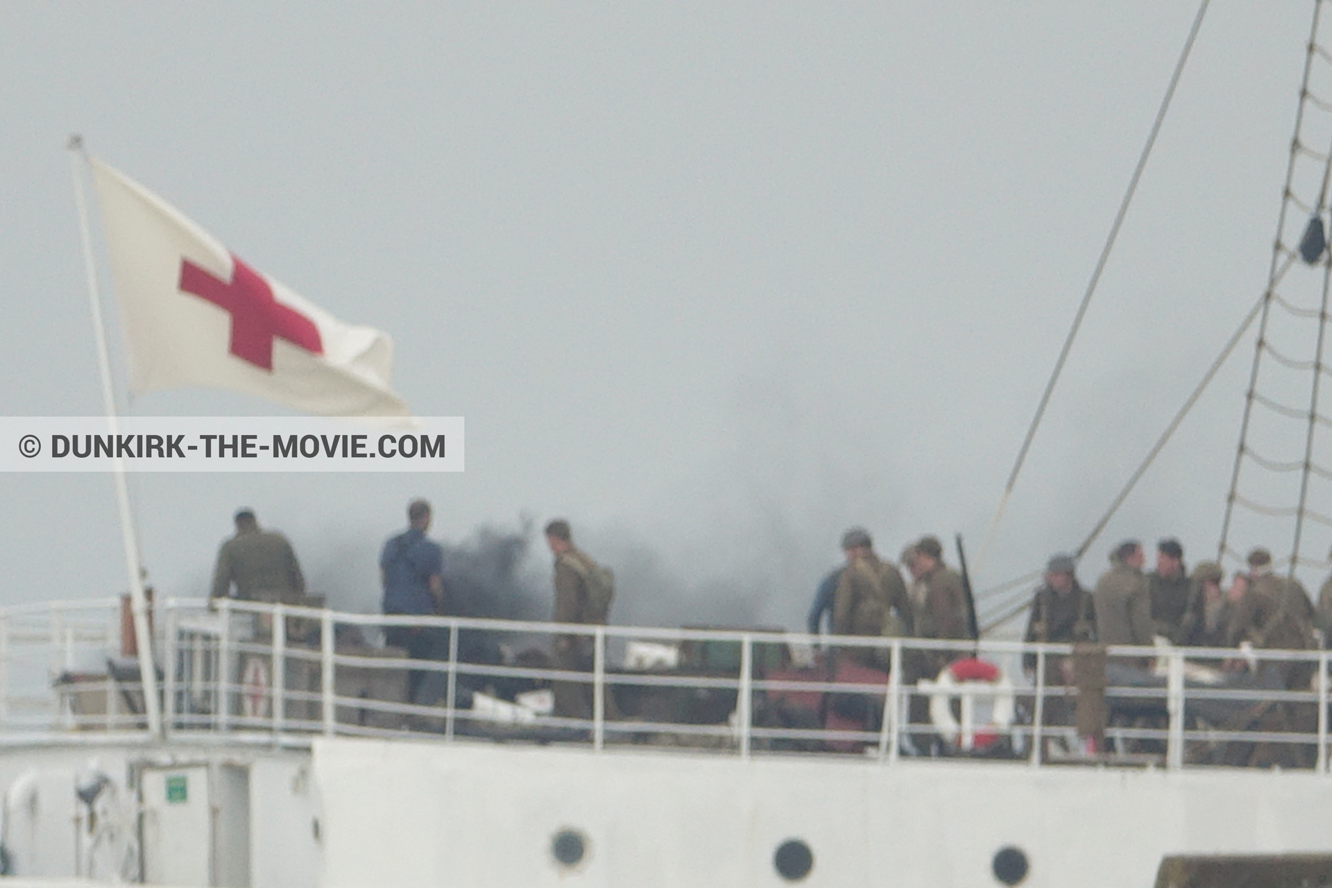 Picture with grey sky, supernumeraries, black smoke, EST pier, technical team, M/S Rogaland,  from behind the scene of the Dunkirk movie by Nolan