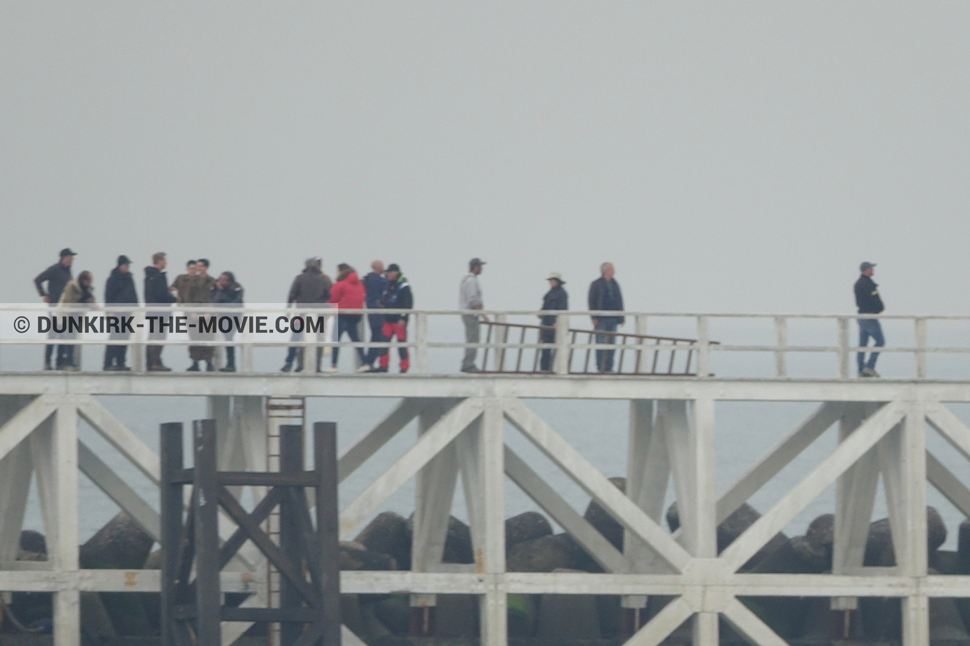 Picture with actor, grey sky, Hoyte van Hoytema, EST pier, Christopher Nolan, technical team, Nilo Otero,  from behind the scene of the Dunkirk movie by Nolan