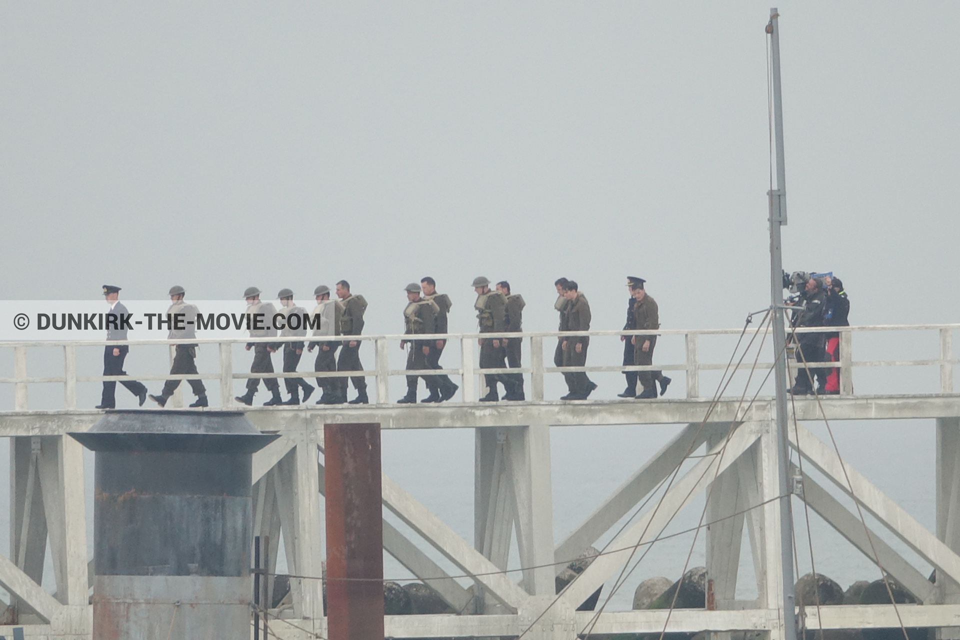 Picture with actor, IMAX camera, grey sky, decor, supernumeraries, Hoyte van Hoytema, EST pier,  from behind the scene of the Dunkirk movie by Nolan