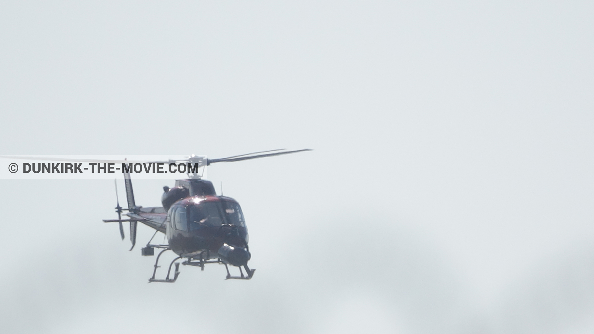 Picture with grey sky, helicopter camera,  from behind the scene of the Dunkirk movie by Nolan