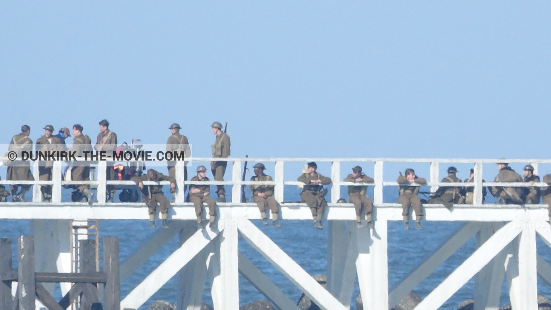 Picture with blue sky, supernumeraries, EST pier, technical team,  from behind the scene of the Dunkirk movie by Nolan