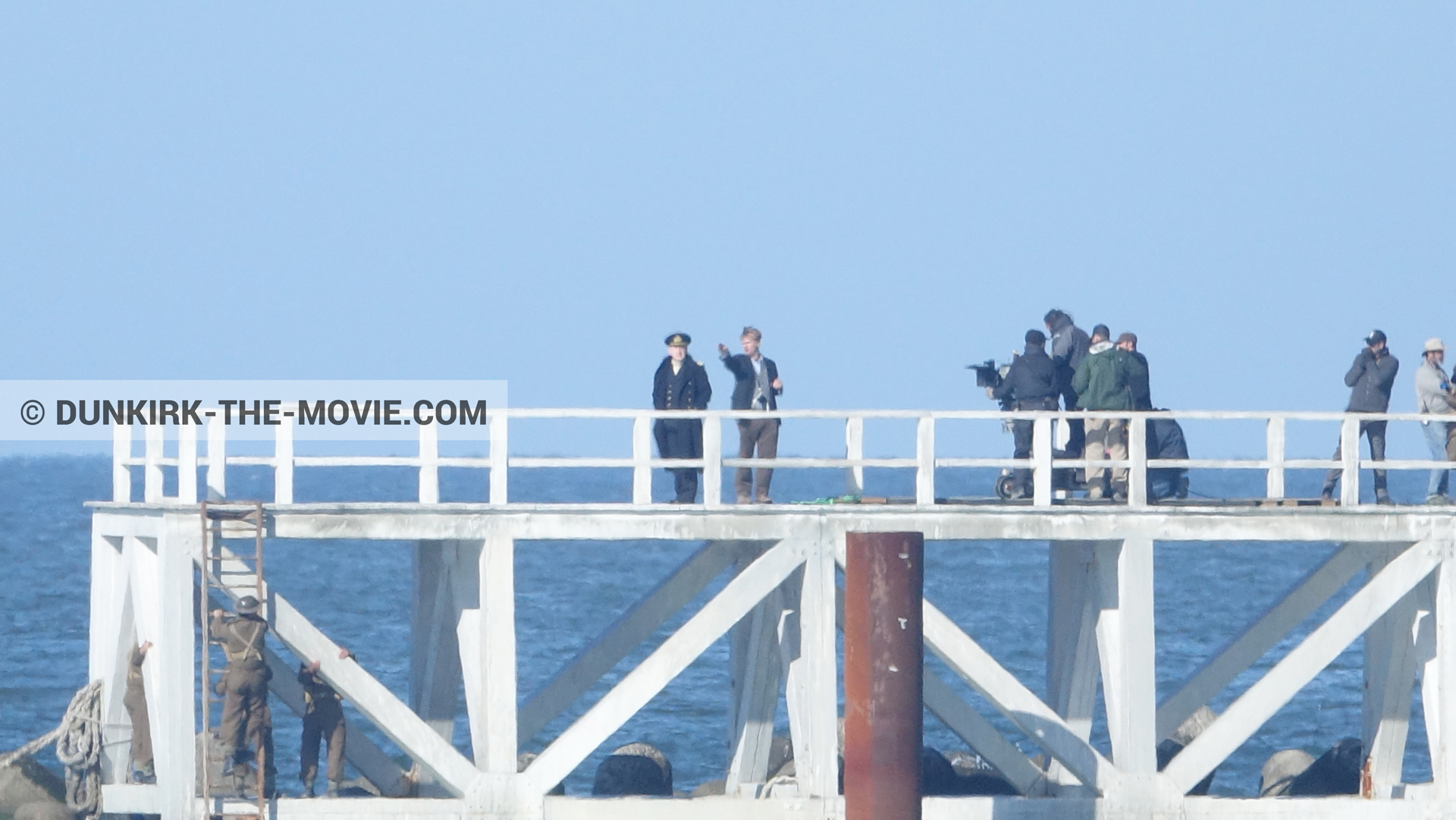 Picture with blue sky, Hoyte van Hoytema, EST pier, Kenneth Branagh, calm sea, Christopher Nolan, technical team,  from behind the scene of the Dunkirk movie by Nolan