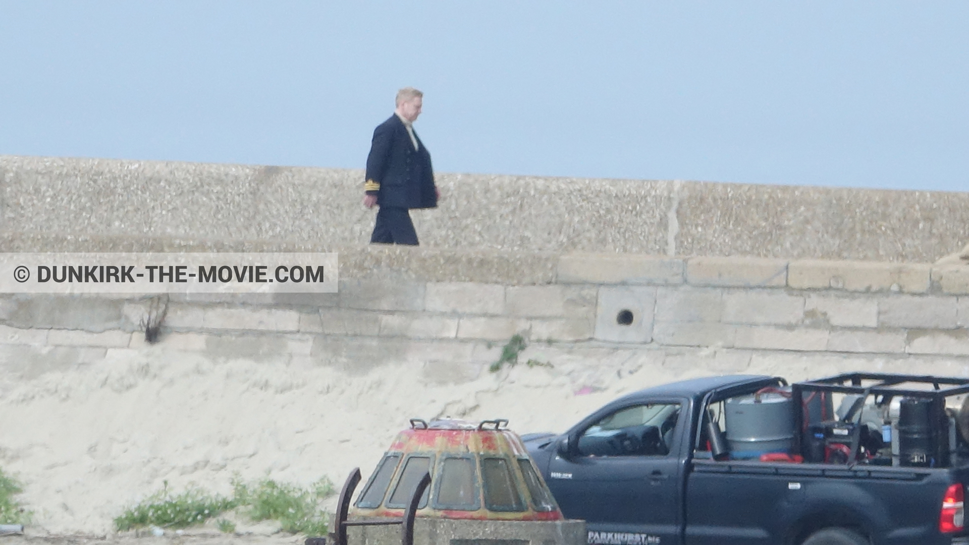 Picture with EST pier, Kenneth Branagh, blue sky,  from behind the scene of the Dunkirk movie by Nolan