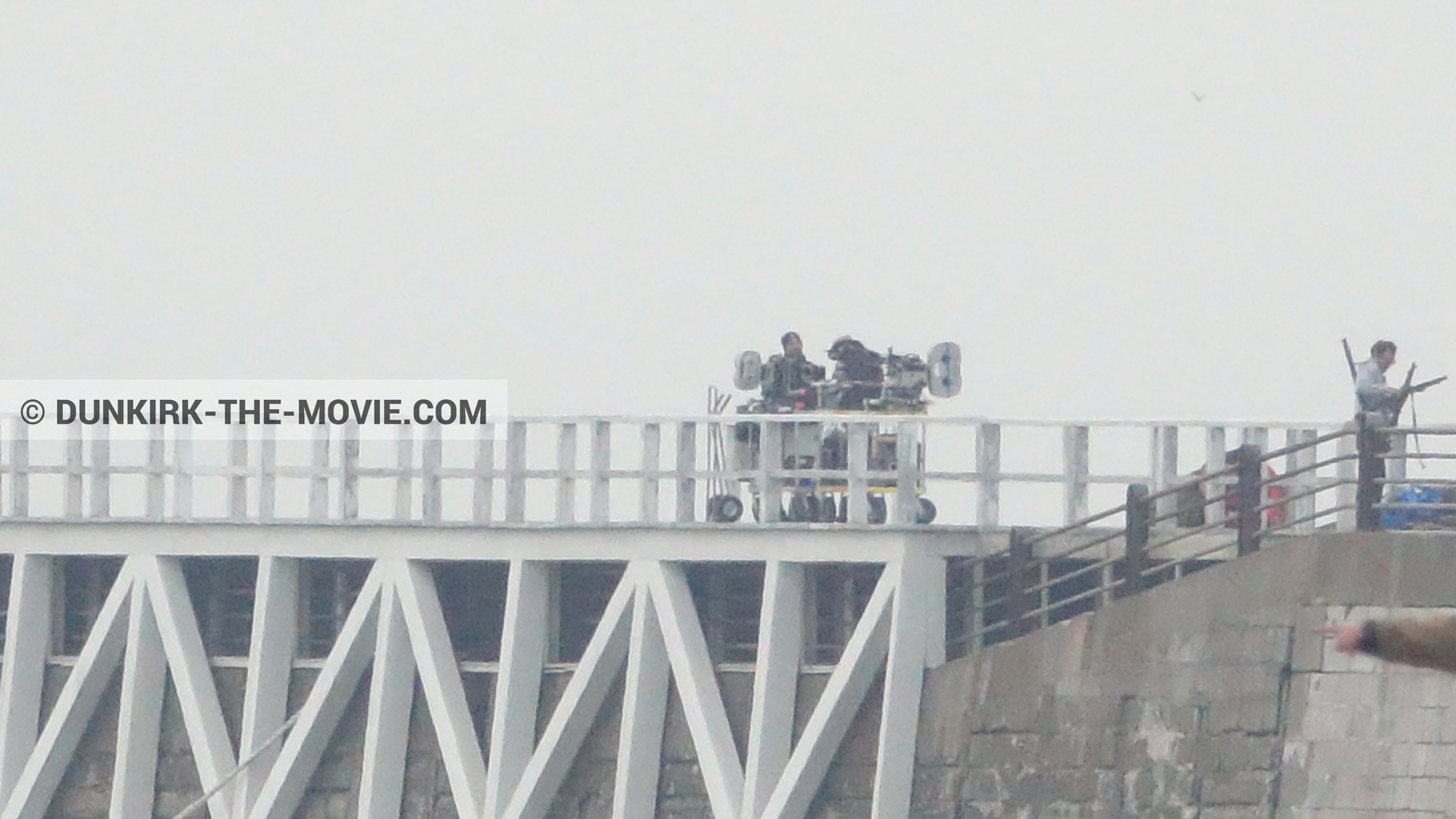Picture with IMAX camera, grey sky, EST pier, technical team,  from behind the scene of the Dunkirk movie by Nolan