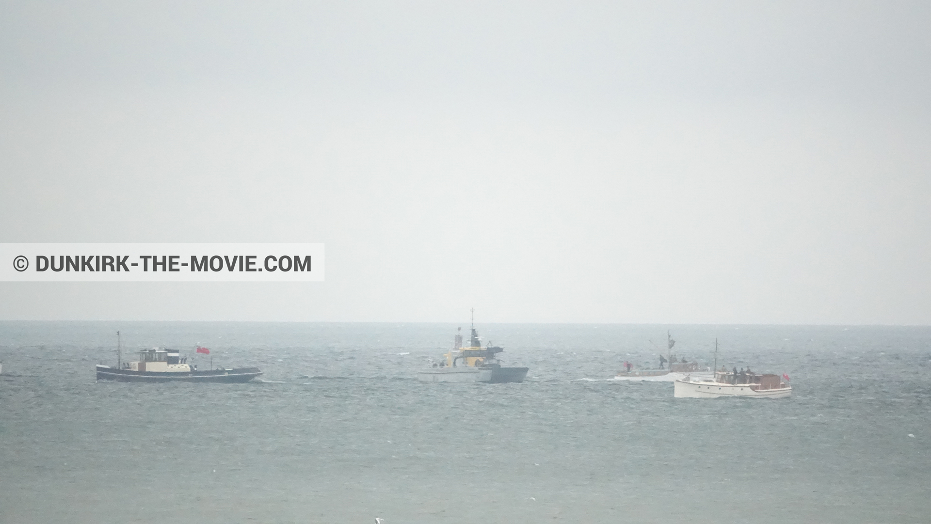 Picture with boat, grey sky,  from behind the scene of the Dunkirk movie by Nolan