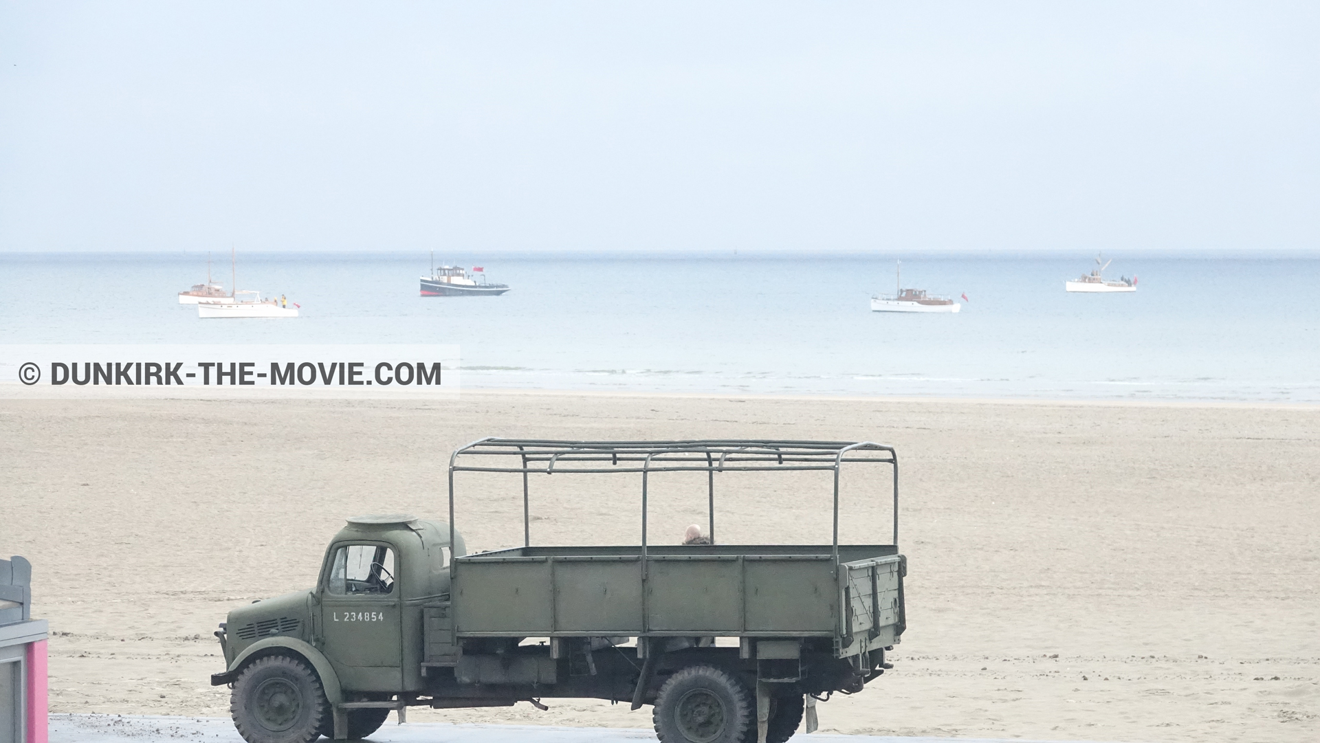 Picture with boat, truck, beach,  from behind the scene of the Dunkirk movie by Nolan
