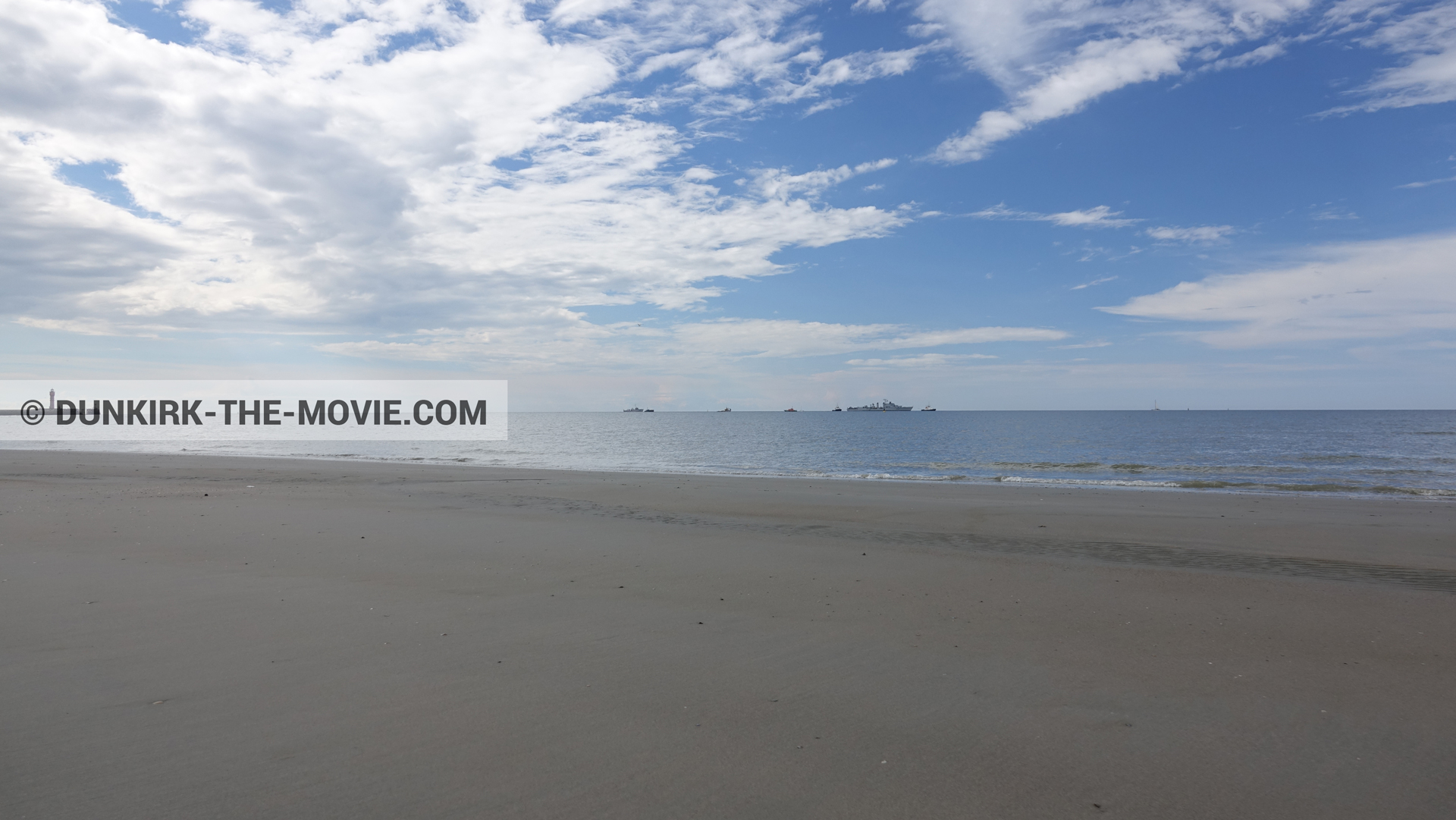 Picture with boat, cloudy sky, St Pol sur Mer lighthouse, beach,  from behind the scene of the Dunkirk movie by Nolan