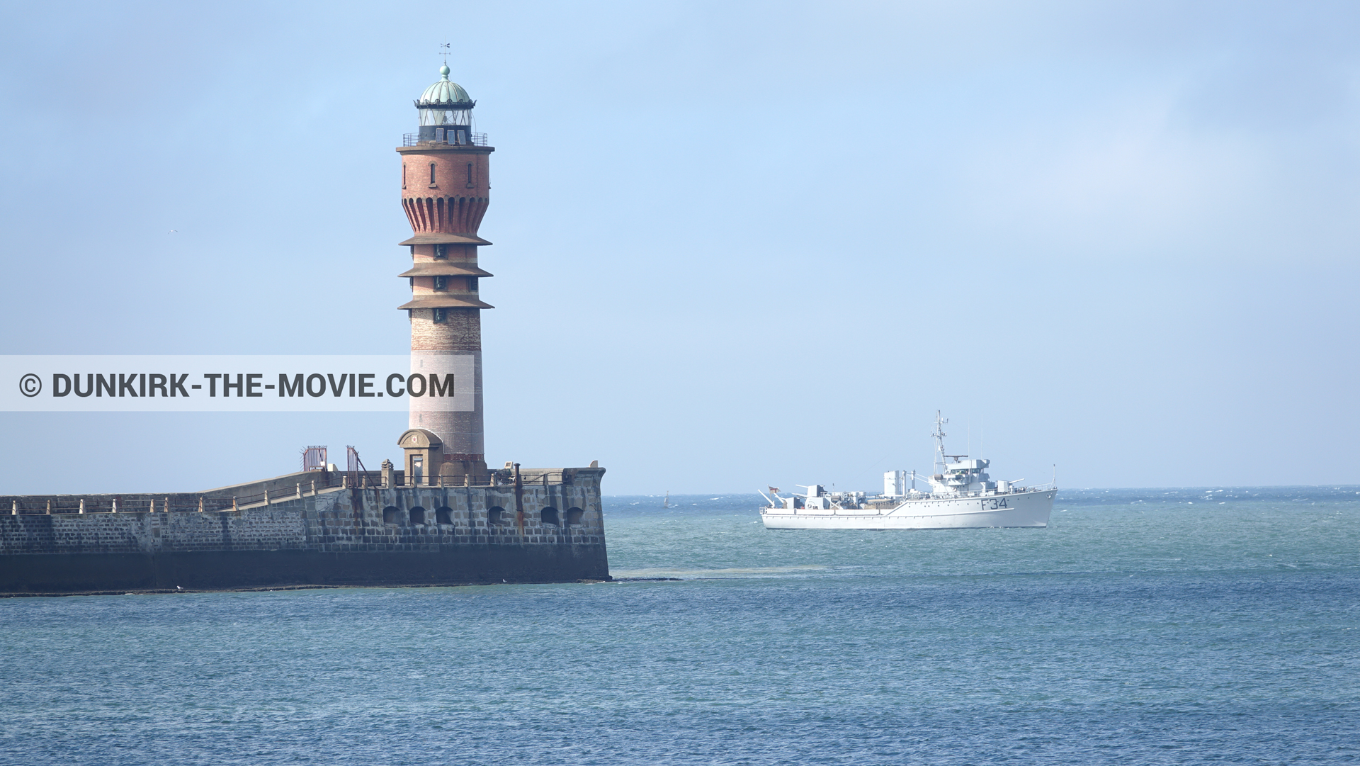 Picture with blue sky, F34 - Hr.Ms. Sittard, calm sea, St Pol sur Mer lighthouse,  from behind the scene of the Dunkirk movie by Nolan